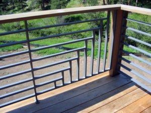 this deck rail has a ladder effect but the spacing is correct and it is up to code